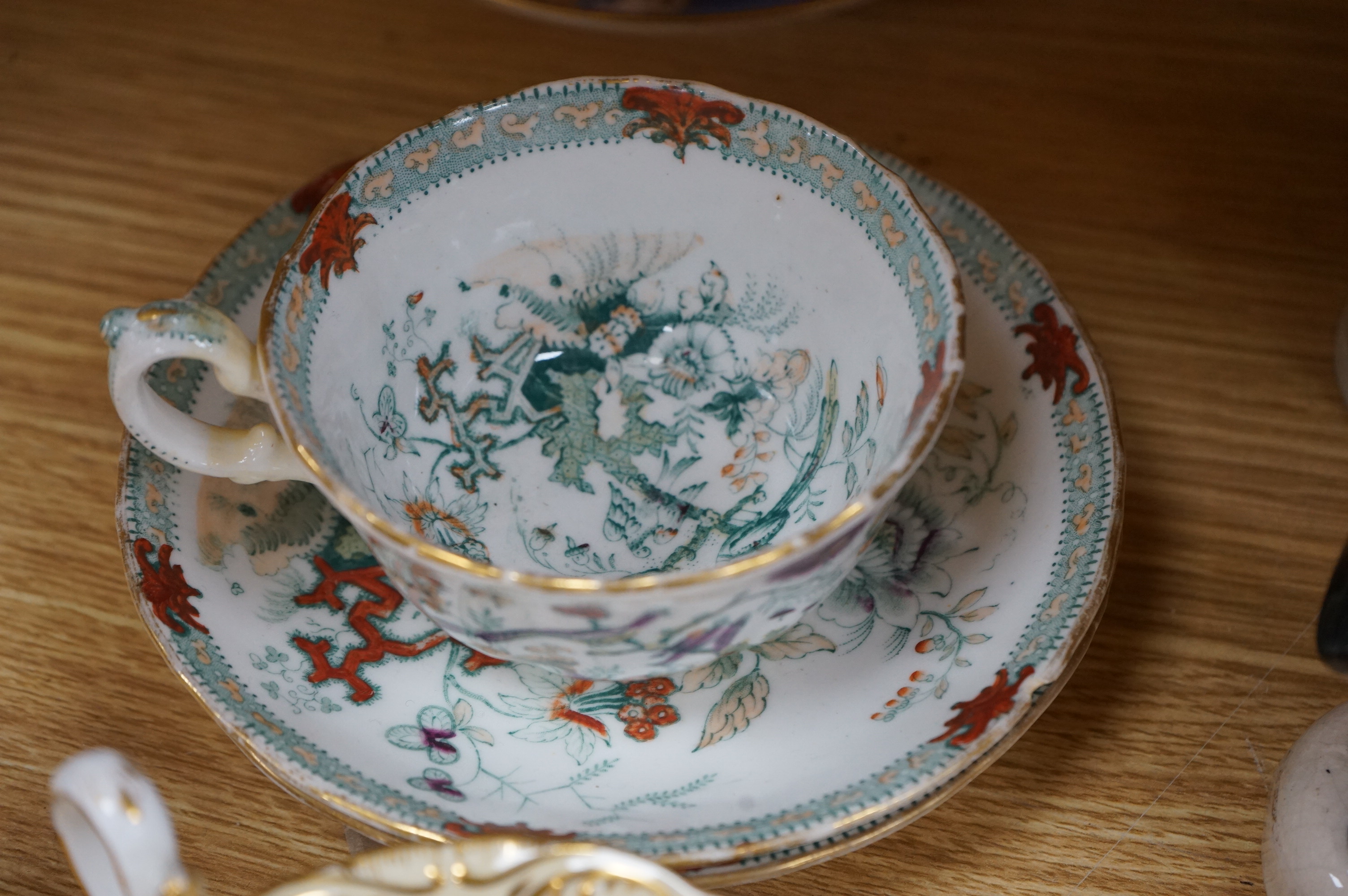 An English part teaset, c.1825 and six Royal Crown Derby coffee cans and saucers etc. Condition - some items cracked chipped and losses to gilding, teapot cover finial broken